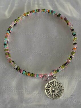 Handmade memory wire bracelet with beads and pendant